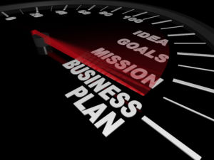 A speedometer with needle pointing to the words Business Plan