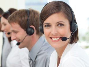 Female customer service agent with headset on in a call center