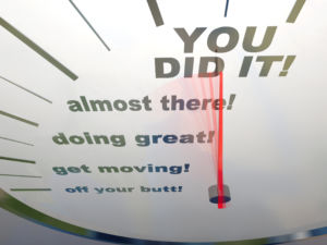 A speedometer showing the words You Did It!